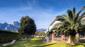 Deluxe Triple Room, Balcony, Garden View | Property grounds