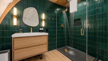 Luxe Dome | Bathroom | Shower, rainfall showerhead, designer toiletries, towels