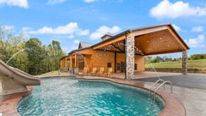A wooden cabin with a swimming pool, outdoor seating, and a slide. - Shawnee Creek Bourbon Trail Chalet (Mercer County)