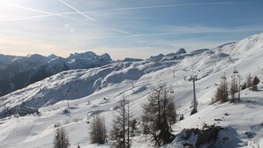 A snow-covered mountain slope with ski lifts and a clear sky. - Gasthof Sprenger (Sillian)
