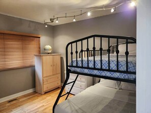 1 bedroom, desk, iron/ironing board, travel crib