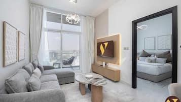 Apartament de luxe, balcó, vistes a la ciutat | Sala d'estar