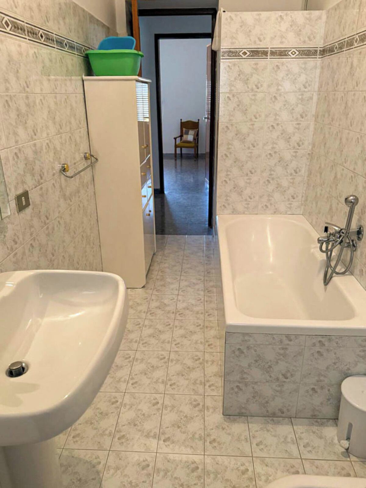 A bathroom with a sink, bathtub, and toilet.