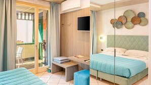 A hotel room with two beds, a desk, a TV, and a balcony with a chair. - Blue Lake Residence (Bardolino)