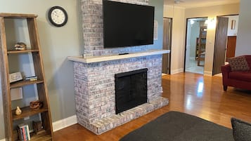 Smart TV, fireplace, books