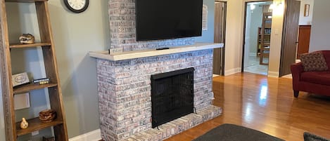 Smart TV, fireplace, books