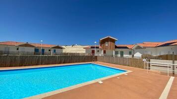 Seasonal outdoor pool, open 8:00 AM to 10:00 PM, pool loungers