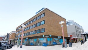 A multi-story building with a sign reading 'Lukhtapolya' on the roof. - Funky City Apartment By Lapland Host (Rovaniemi)