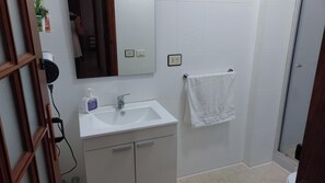 Shower, hair dryer, towels, soap