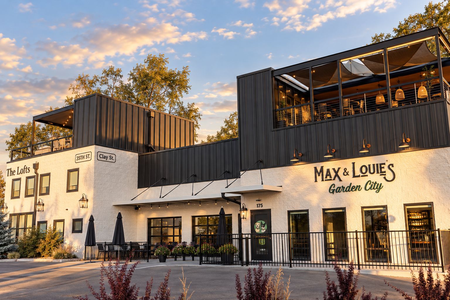 A modern building with a restaurant named 'Max & Louie's Garden City' on the ground floor.