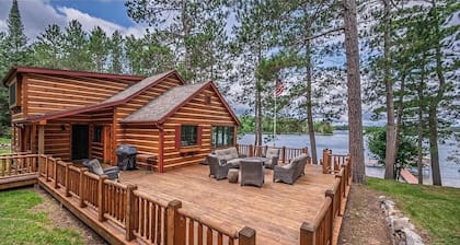 Private Big Portage Lake retreat, two separate homes, sandy beach, sleeps 14.