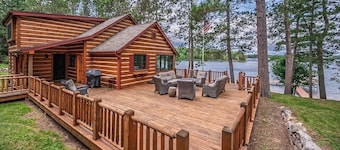 Private Big Portage Lake retreat, two separate homes, sandy beach, sleeps 14.