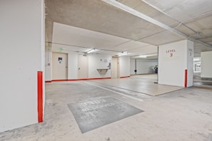 A multi-level parking garage with clear signage indicating 'Level 3' and 'Reserved Parking.' - High-Floor Ocean View in Waikiki | Pool, Free Park (Honolulu)