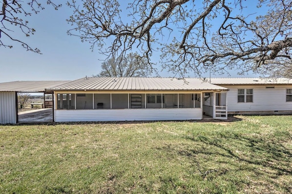 A single-story house with a covered porch and a small front yard.