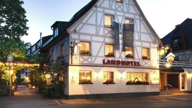 A traditional half-timbered building with the sign 'LANDHOTEL' indicating a hotel establishment. - Romantik Landhotel 3Kronen (Adelsdorf)