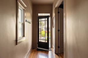 Entryway: Bright and welcoming with a glass door and gleaming hardwoods! - The Single Barrel - Deck, Fire Pit, Hot Tub, Games (Louisville)