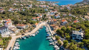 An aerial view of a coastal town with a marina, houses, and hilly terrain. - Villa Verde Ra anj With Heated Pool (Rogoznica)