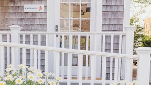 A house with a white porch, a sign reading 'ENDEAVOR,' and a white railing. - 2 bedroom, 2.5 bathroom (Nantucket)