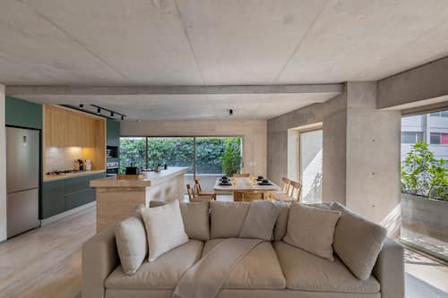 Premium Apartment, Balcony | Living area | 50-inch Smart TV with digital channels