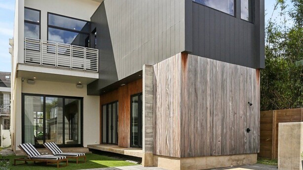 A modern two-story house with a swimming pool, a balcony, and a well-maintained lawn. - Modern House, walk to French Quarter or the street car is a block away! (New Orleans)
