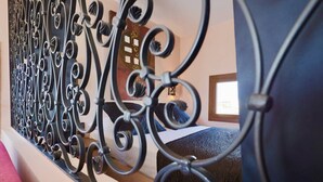 A room with a bed, a window, and a decorative metal railing. - PINK LADY - Villa Port Nature 12 - Luxury - 4 people (AGDE)