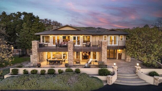 A two-story house with a patio, outdoor seating, and a driveway. - El Pomar Estate - Main House by Avantstay Pool + Hot Tub + Firepit + Outdoor Dining + Vineyard Views (Templeton)