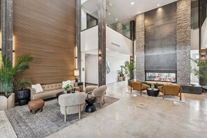A spacious lobby with a high ceiling, a fireplace, and multiple seating areas. - Ski Escape at The Mason, AC , Hot Tubs, Near Deer Valley and Park City (Heber City)