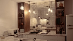 A modern kitchen with a marble countertop, built-in microwave, and a wooden shelf with kitchenware. - Storytellers - Checkinhome- T1 (São Pedro)