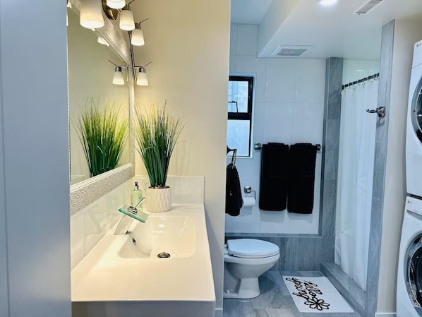 Shower, hair dryer, towels, soap