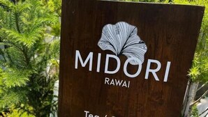 A signboard for MIDORI Rawai with a breakfast menu including toast, eggs, sausages, and a tomato. - Midori Rawai (Rawai)