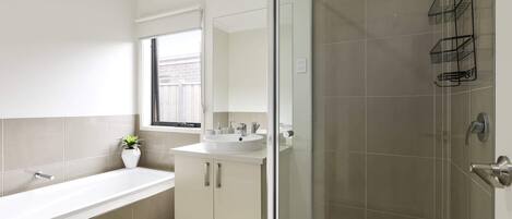 Shower, hair dryer, towels, shampoo