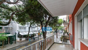 A hotel with a balcony, trees, and a street view. - Minetto / city center apt *Via Bafile* (Jesolo)