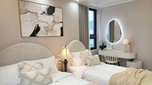 A hotel room with two beds, a bedside table with a lamp, a mirror, a window with curtains, and a wall-mounted abstract painting. - 4rest Stay Jongno (Seoul)