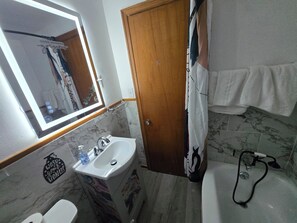 Hair dryer, towels, soap, shampoo