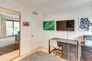 A bedroom with a bed, a desk, a dresser, and a mirror. - 2 Mi to Dtwn! Snowbird Gem w/ Pool in Palm Springs (Palm Springs)