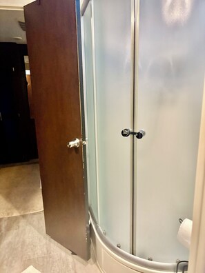 Shower, towels, soap, toilet paper