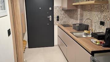 Suite Deluxe, balcone, vista mare | Angolo cottura privato