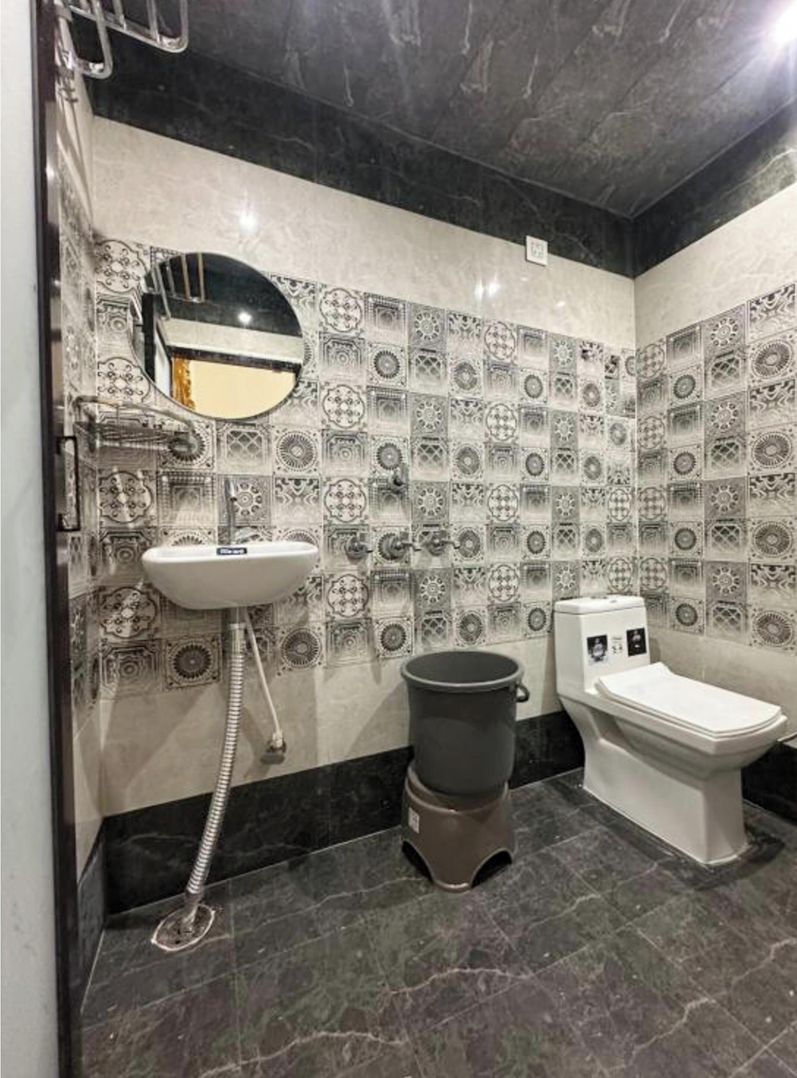 Shower, rainfall showerhead, slippers, towels
