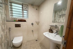 Bidet, towels, soap, toilet paper - Balcony Deluxe Room with Washroom & Workstation inside a 4BHK Apartment (Bengaluru)