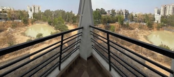 Balcony Deluxe Room with Washroom & Workstation inside a 4BHK Apartment