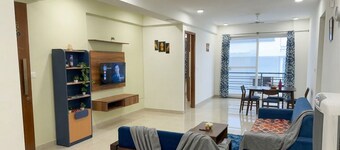 Balcony Deluxe Room with Washroom & Workstation inside a 4BHK Apartment