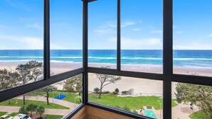 A beach view through a window with a clear sky. - Pure Sunrise Oceanview 2BR Sub-Penthouse +Parking (Surfers Paradise)