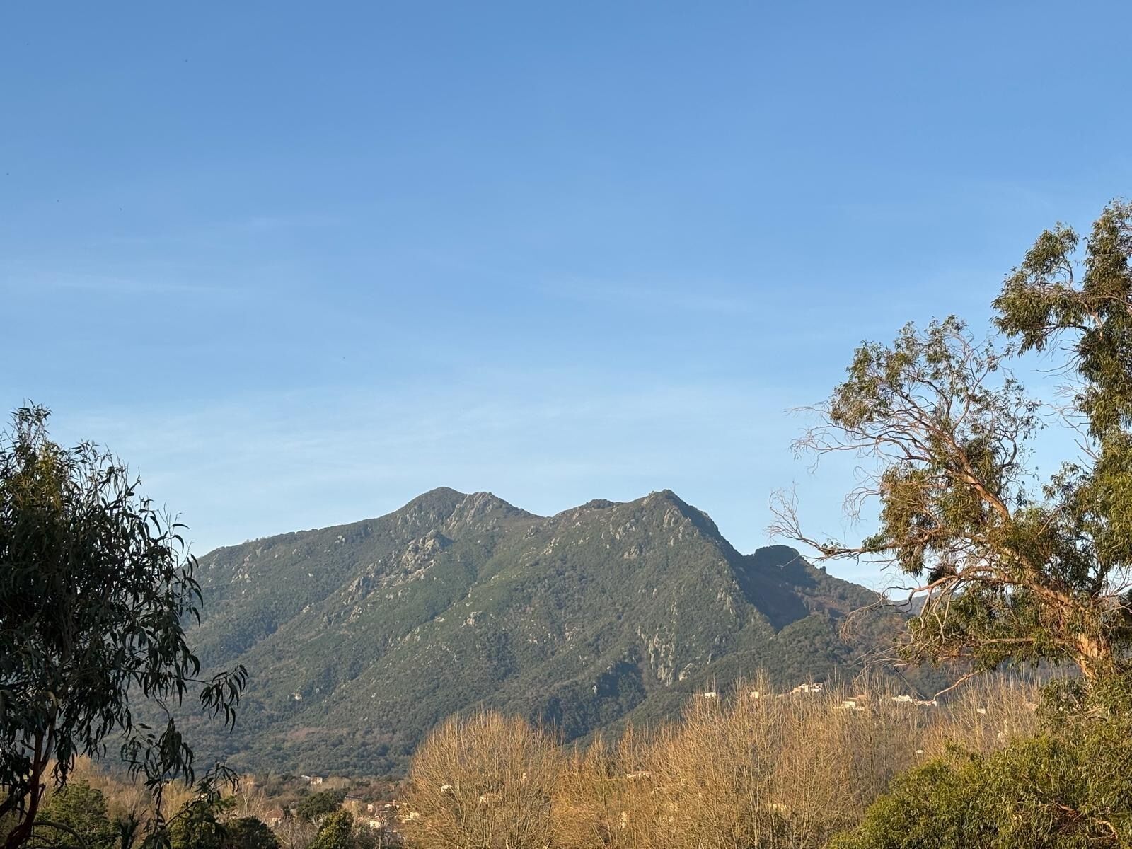 A mountainous landscape with a clear sky.