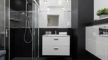 Shower, hair dryer, towels, shampoo