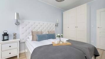1 bedroom, desk, iron/ironing board, travel crib