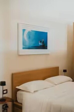 Camera Deluxe con letto matrimoniale o 2 letti singoli | Una cassaforte in camera, tende oscuranti, insonorizzazione