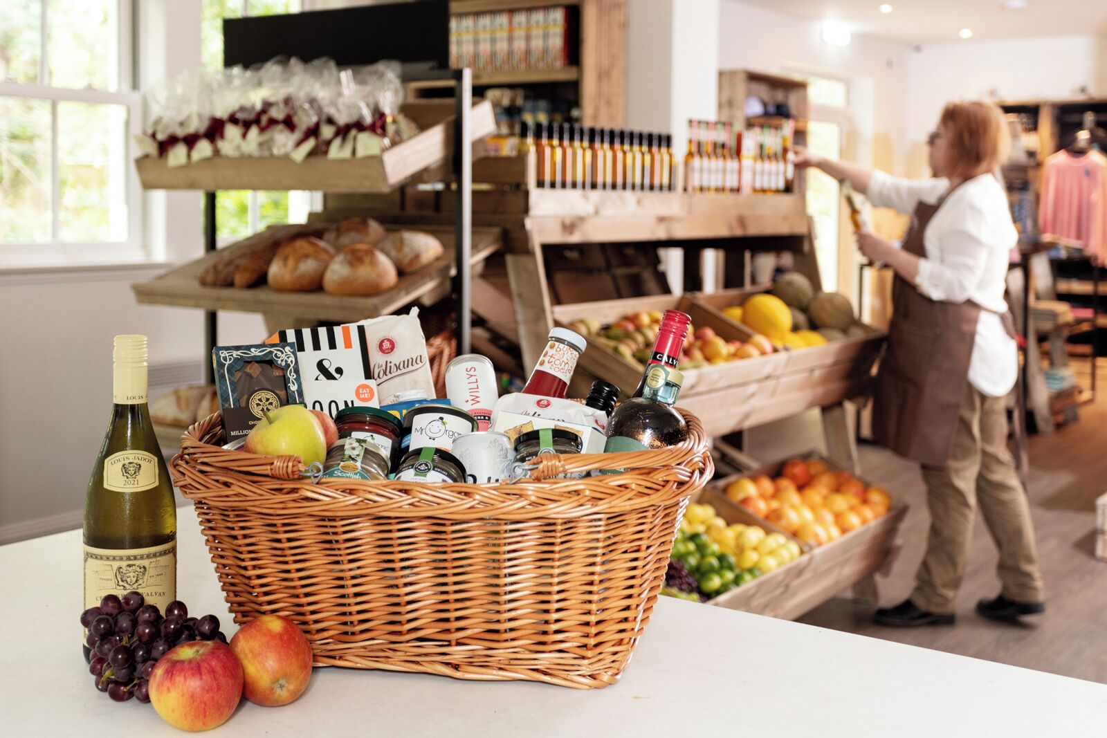 A bakery display with bread, pastries, and a variety of packaged goods.