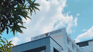 A modern building with a sign reading 'MELVET RESIDENCY.' - HOTEL MELVET RESIDENCY (Kanayannur)