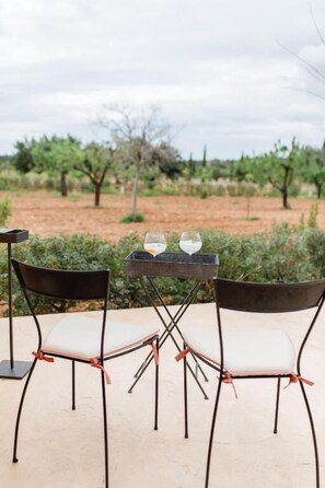 Suite Deluxe, vistas al jardín | Restaurante al aire libre