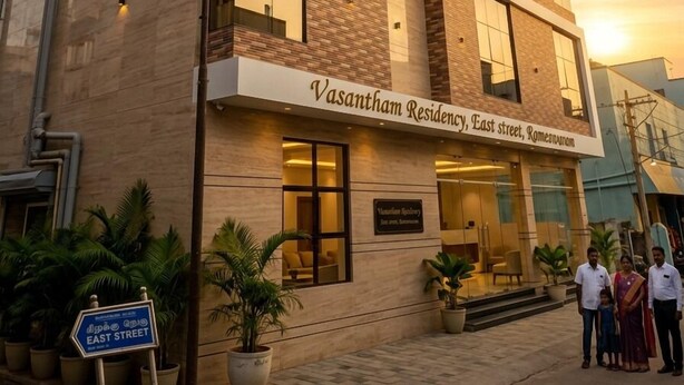 A multi-story building with a sign reading 'Vasantam Residency, East street, Romeeranam.' - Vasantham Residency (Rameshwaram)